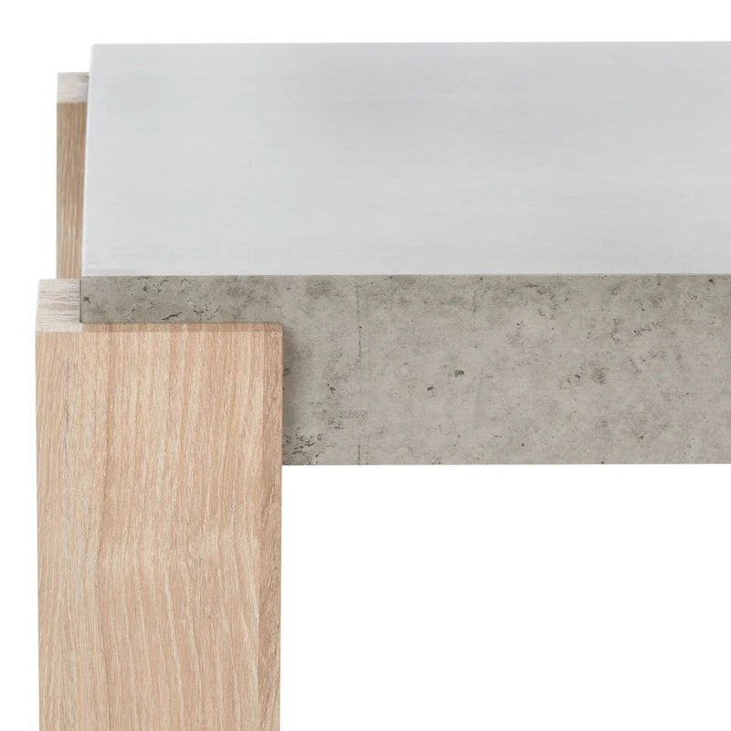 Table basse moderne avec plateau imitation béton et pieds colonnes