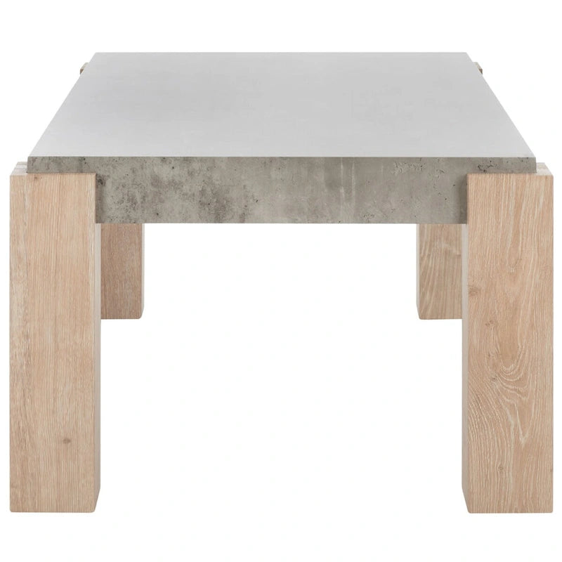 Table basse moderne avec plateau imitation béton et pieds colonnes